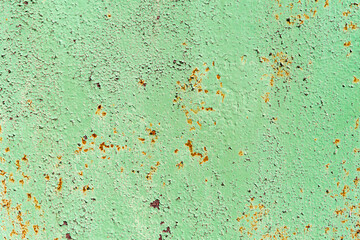 texture of metal covered with rust and old green paint. rough iron background