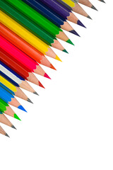 A angle line of different colored wood pencil crayons placed on a white background