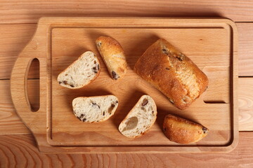 Ciabatta with black olives. Italian white bread.