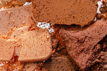 Background of scattered crashed eye shadows of different colors