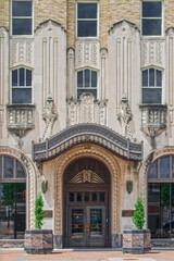 Fototapeta na wymiar 07_25_2020 ONG Building - One of the first zigzag art deco style buildings in Tulsa with hanging ornate entrance canopy and pink marble planters