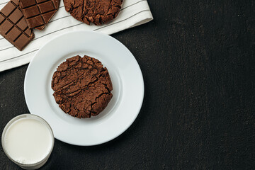 Chocolate cookies on dark table close up