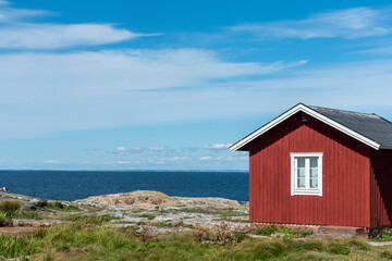 Fototapeta na wymiar Red wooden building at Maseskar in Sweden