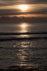 The sun hides in the clouds