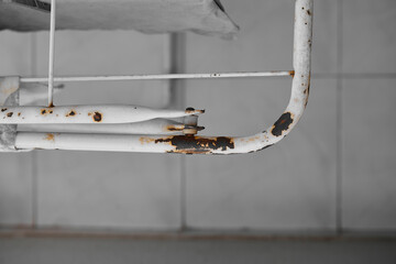 Rusty, worn stainless steel clothes drying rack