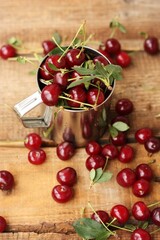 Ripe red cherries in an iron cup