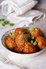 Meatballs with tomato sauce and cheese. Vertical photo