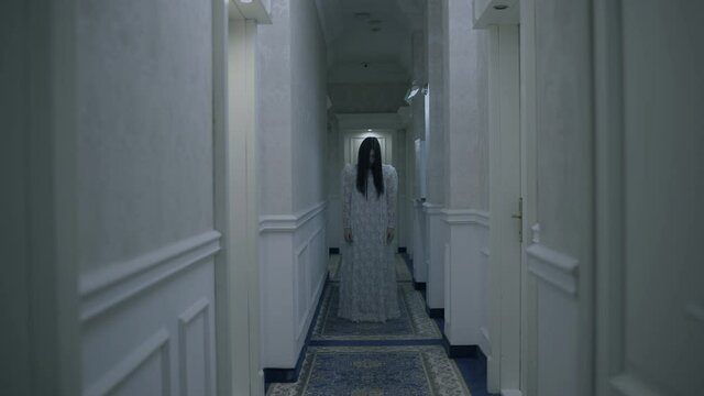 Spirit of widow appearing in mysterious hotel corridor, scary ghost of bride