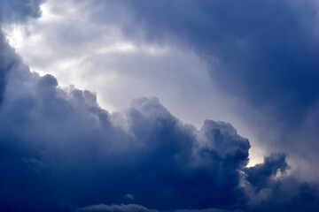 Fototapeta na wymiar The stormy beauty of the blue Cumulus clouds in summer