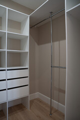 Light empty wardrobe, with white shelves