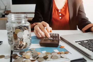 Healthcare costs and fees concept.Hand of smart doctor used a calculator for medical costs in modern hospital