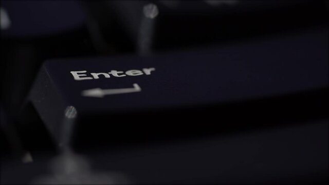 Macro view of Human finger pressing a Backspace key on the computer keyboard