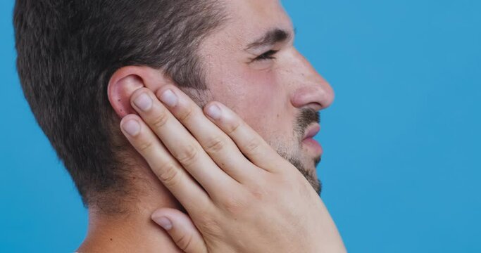 Closeup up profile of sick man having ear pain