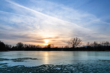 Scenic view over frozen lake in sunset in Russia.