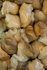 Pure raw rapana (Rapana pontica) meat as background texture close-up.