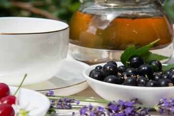 Summer tea in the garden with currants, cherries and lavender.