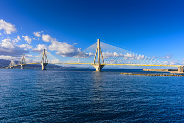 Fototapeta na wymiar The Rion-Antirion Bridge connects the Peloponnese Peninsula with mainland Greece, this Cable-stayed road bridge with pedestrian sidewalks over the Gulf of Corinth, Greece