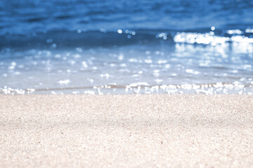 Soft waves on sandy beach. Macro photography