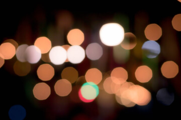 Blur the lights on the restaurant. Blurred cafe background with bokeh. orange ,red, light, blue, green, pink.