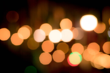 Blur the lights on the restaurant. Blurred cafe background with bokeh. orange ,red, light, blue, green, pink.