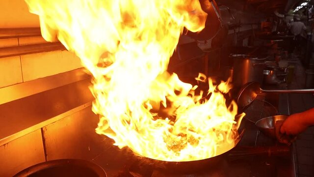 Fire hard cooking with stir fry on wok