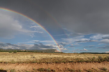 double rainbow over fields