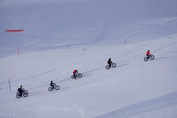 fat tire biking on the slope of a ski resort in the Alps, France