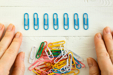 colorful  paper clips on white background, office life, perfectionism, psychological training