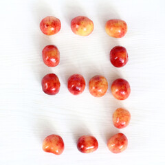 number nine from berries of sweet cherry on light surface, top view. sweet countdown 9