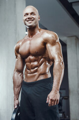 Fototapeta na wymiar Bodybuilder athletic man workout muscles exercise.