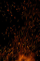 flame of fire with sparks on a black background