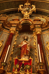 
ancient church wide-angle view inside with local saints of faith and christian worship golden green and red details