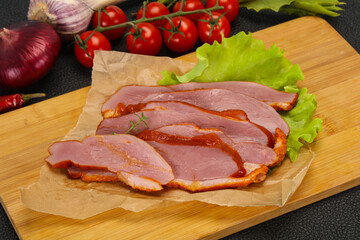Sliced smoked duck breast served salad