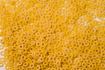 small rings Italian dry raw pasta macaroni bronze drawn full frame  top view