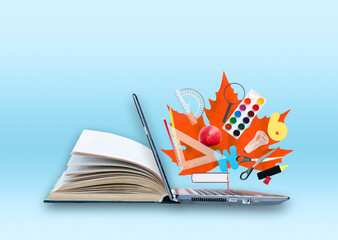 Open book with laptop and educations objects on the blue background