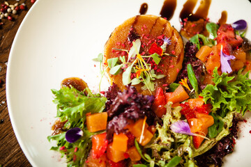 Black Angus hand-made dumplings. Cucumber-julienne with chilli-garlic butter or beef stock with sour cream. Delicious meat food closeup served on a table for lunch in modern cuisine gourmet restaurant