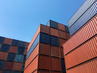 Fototapeta premium Colourful stack pattern of cargo shipping containers in shipping yard,dock yard for transportation,import,export industrial concept