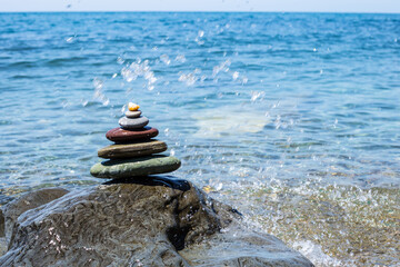 Stack of zen stones near sea. Harmony, balance