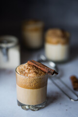 Close up of Dalgona whipped coffee on light background