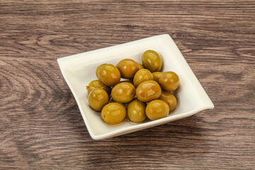 Green pickled olives in the bowl