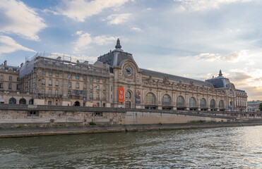 Fototapeta na wymiar Paris, France - 07 17 2020: View of Orsay Museum from a boat on the Seine