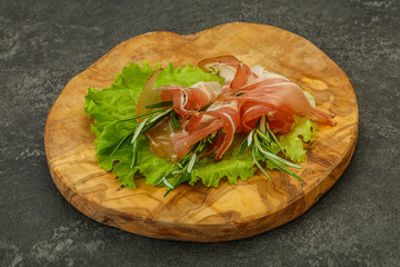 Sliced pork Jamon with rosemary