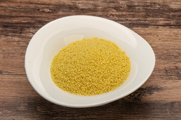 Raw cous cous heap in the bowl