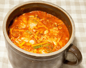 Clay pot with kimchi, traditional Korean fermented food. Ready probiotic, healthy food.