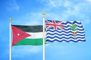 Jordan and British Indian Territory two flags on flagpoles and blue cloudy sky