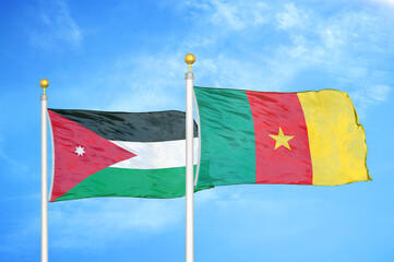 Jordan and Cameroon  two flags on flagpoles and blue cloudy sky