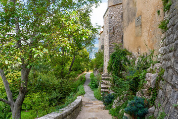 A lush mountainside path around the medieval walled village of Gourdon in the Alpes-Maritimes region of Southern France.