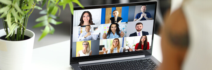Woman talking with international colleagues using online video chat service