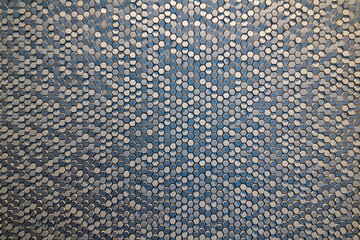 hexagonal ceramic chips reflecting light & shadow