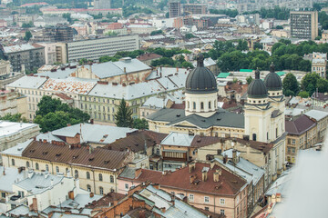 top view from town hall tower on old house rooftops in historical city center in Lviv